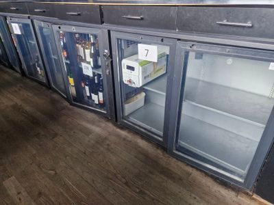 a refrigerator that is sitting in the middle of a room