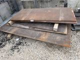 several pieces of wood are stacked on top of each other in a pile
