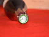 a bottle of wine that is sitting on a table