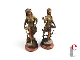 paire de figurines anciennes en bronze représentant une femme et un homme
