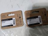 two packages of electronic devices sitting on a table
