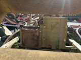 a picture of a machine that is sitting in the dirt
