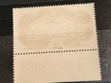 a piece of paper with a stamp on it sitting on top of a table