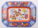 a colorful tray with a picture of fruits and flowers on it