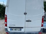 a white van that is parked on the side of the road