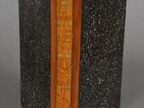 an image of a book with a wooden cover and a bookmark