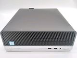 the back of a dell desktop computer sitting on top of a white surface