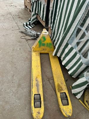 two skis that are laying on the ground next to a tent