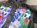 a black jacket with a colorful design on it