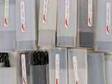 many different types of pens in a plastic container