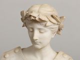 marble bust of a woman with a wreath of flowers on her head