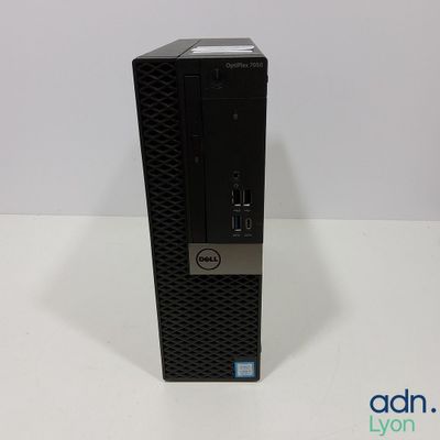 a close up of a dell desktop computer on a white surface