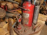 a red fire hydrant sitting on top of a wooden table
