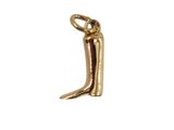a gold plated figurine of a person holding a banana