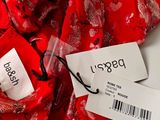 a close up of a red scarf with a price tag on it