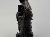 an image of a statue of a woman with a bird on her head