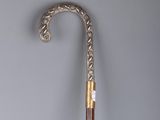 a silver and gold umbrella with a wooden handle