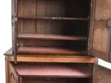 a wooden cabinet with a door open and a drawer underneath it