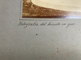 an old photo of a man riding a horse on the beach