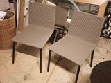 two chairs sitting next to each other in a room
