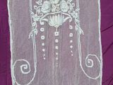 an image of a white embroidered table cloth with a bird and flowers on it