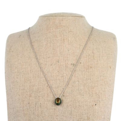 a close up of a mannequin torso with a necklace on it