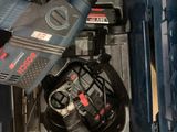 a drill in a tool box with a corded cord
