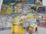 a lot of pokemon cards sitting on a table