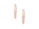 une paire de boucles d'oreilles créoles en or rose serties de diamants