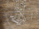 a close up of a piece of wood with a drawing of a bear on it