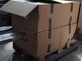 a box on a pallet with a laptop on top of it