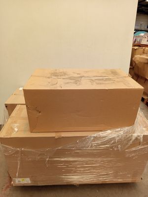 a stack of boxes sitting on top of each other in a room