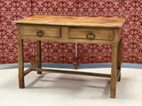 a small wooden table with two drawers on it