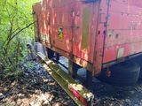 a red truck that is parked on the side of the road
