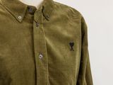 a close up of a shirt with holes on it