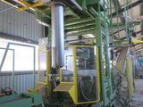 a picture of a machine that is working on a piece of machinery