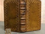 an old book that is sitting on a table
