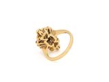 a close up of a gold ring on a white background