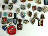 many different types of badges on a white surface