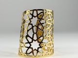 a close up of a gold ring on a white surface