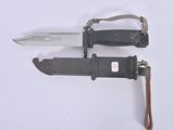 two knives that are laying next to each other on a table