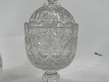 a clear glass jar with a lid on a table