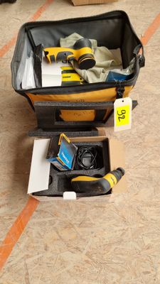 a suitcase with tools in it sitting on the floor