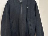 the jacket is hanging on the wall next to the door