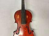 an old violin hanging on the wall in a room
