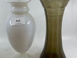 two vases sitting next to each other on a table
