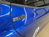 a close up of a car door handle with a sticker on it