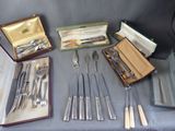 many different types of silverware on a table