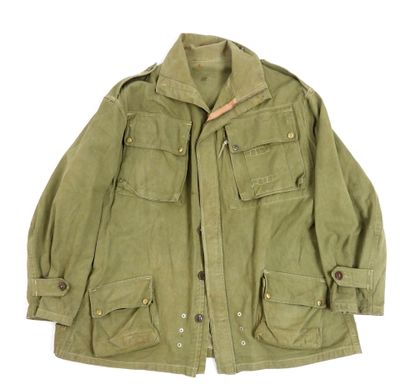 a green jacket with buttons on the chest and a buttoned collar