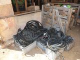 a pile of wires and other electrical equipment in a room